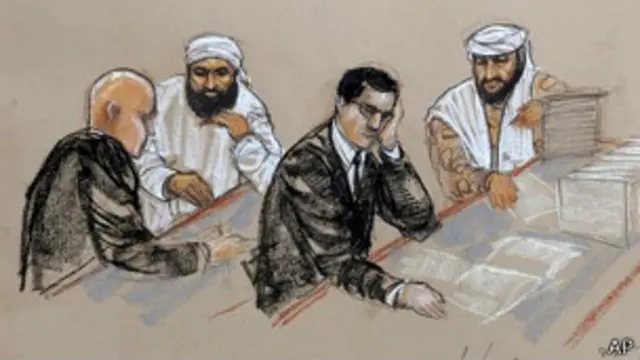 на рисунке изображен заключенный со своим адвокатом во время слушания