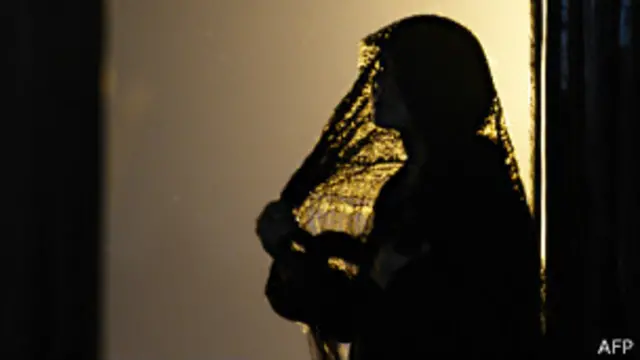 a woman wearing a veil, AFP
