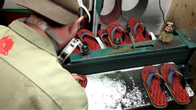 a veteran working in a flip-flop factory