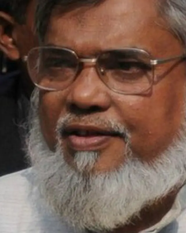 मुजाहिद पर नरसंहार और प्रताड़ना के आरोप हैं.