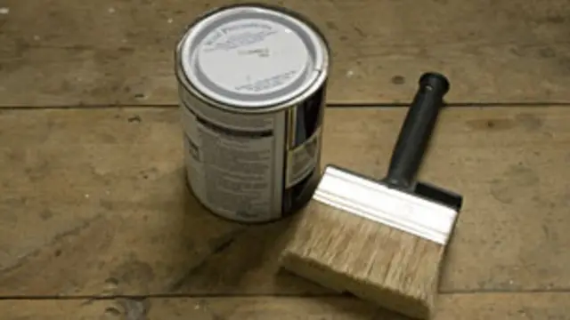 paint brush and tin of paint