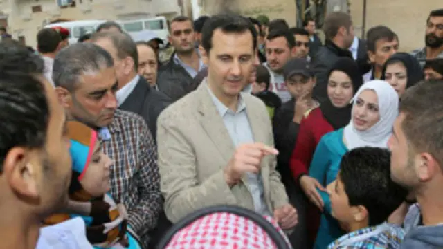 بازدید اسد از یک ناحیه جنگ زده