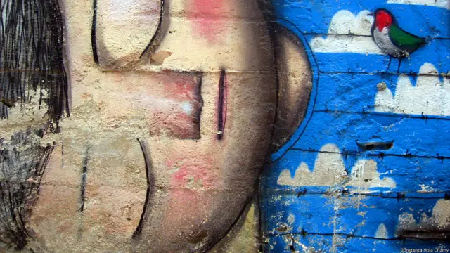 सोए हुए फ़लस्तीनी लड़के की ग्रैफिटी