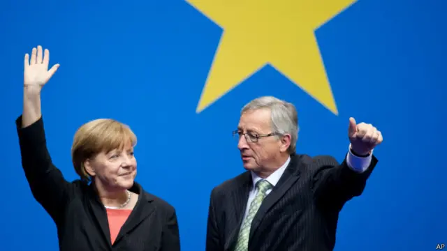 एंजेला मर्केल और जीन क्लाउडी जंकर