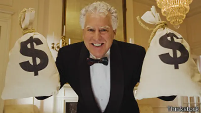 Hombre con bolsas de dolares