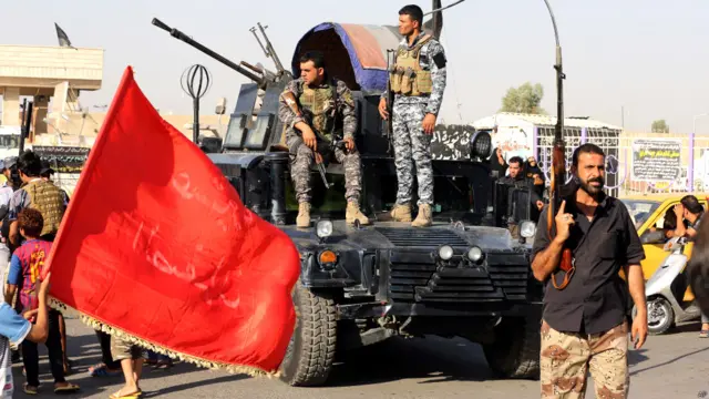 इराक़ के हालात, इराक़ी पुलिस के जवान, शिया लड़ाके