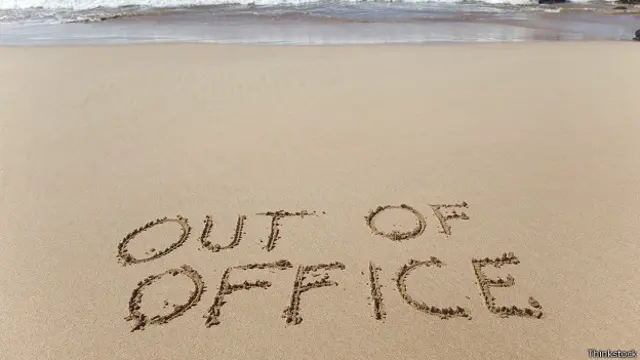 Надпись на песке Out of office