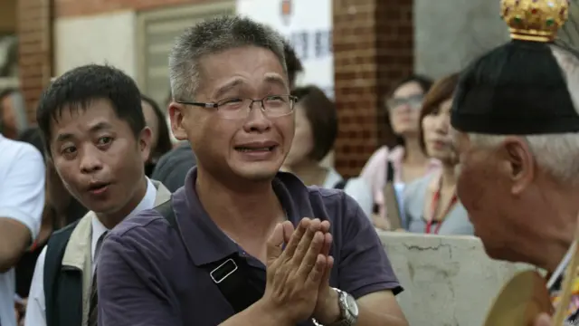 悲痛的家屬（AP）