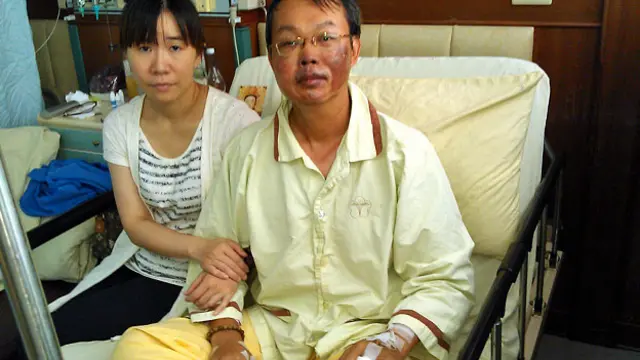 黃世華（右）與妻子（BBC中文網圖片3/8/2014）