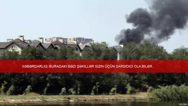 Donetskdə atəş açılandan az sonra binanın üstündə tüstü görünüb