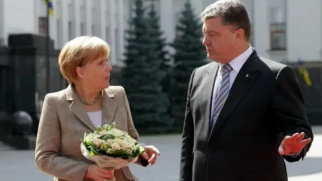 تجري ميركل محادثات في كييف