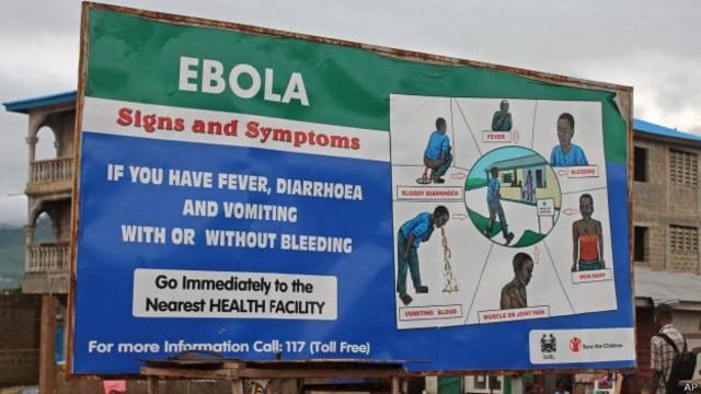 Плакат, описывающий симптомы лихорадки Эбола во Фритауне, столице Сьерра-Леоне