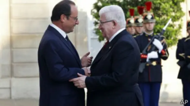 Los presidentes Hollande y Masum