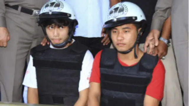 Two Burmese workers are suspected of murdering two british tourists