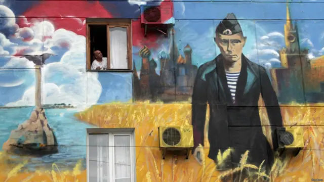 граффити на стене с изображением путина 