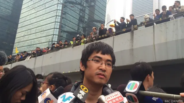 香港学联秘书长周永康表示,成员及示威者将以静坐面对警方清场留守最后一刻(BBC中文网记者陈志芬摄)。