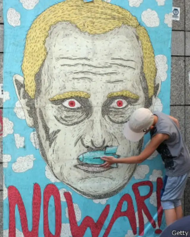 Mural con el rostro de Putin en Kiev