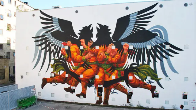 Mural del grafitero argentino JAZ, se ven hombres con cabeza águila