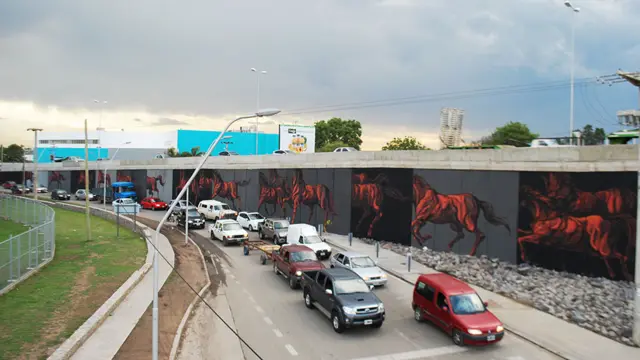 Mural del grafitero argentino JAZ, se ven caballos en una autopistas 