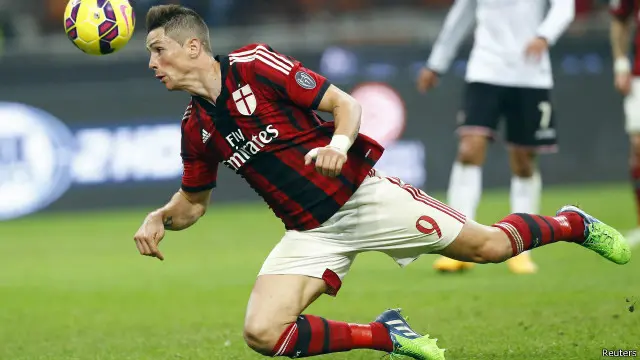 AC Milan meminjamkan Torres ke Atletico Madrid setelah mengontraknya secara permanen.
