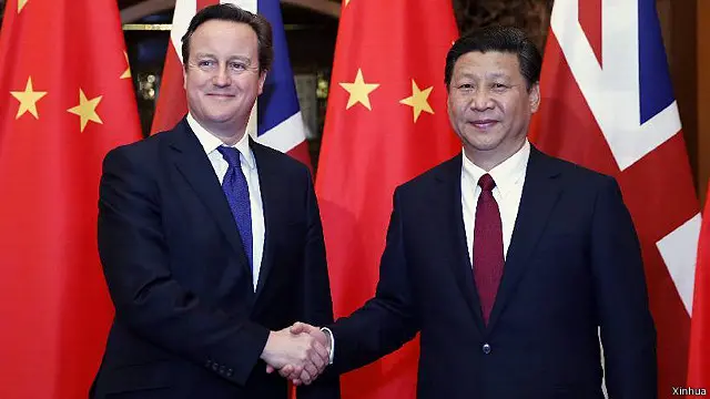 英國首相卡梅倫2013年底訪華在北京與中國國家主席習近平會見。(資料圖片)