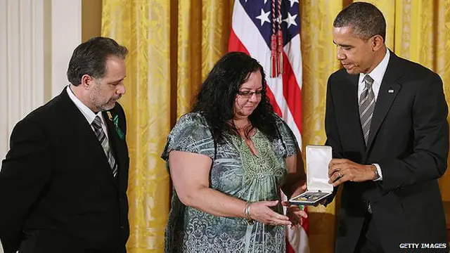 Donna y Carlos Soto con Obama