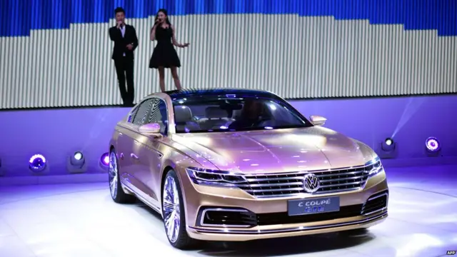 Models present VW C Coupe GTE car during a presentation at the 16th Shanghai International Automobile Industry Exhibition in Shanghai on April 20, 2015.