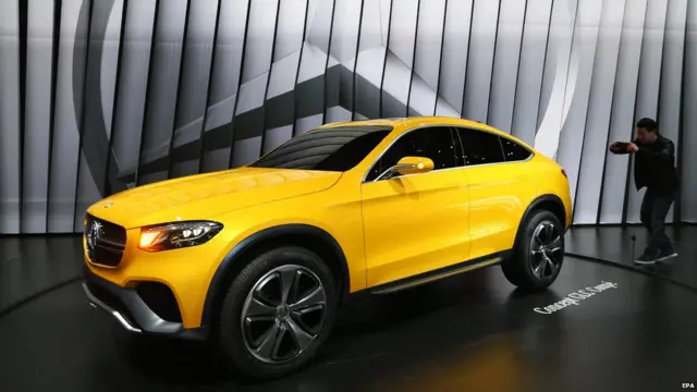A visitor take photos of the Mercedes-Benz Concept GLC Coupe at the 16th Shanghai International Automobile Industry Exhibition in Shanghai, China, 21 April 2015.