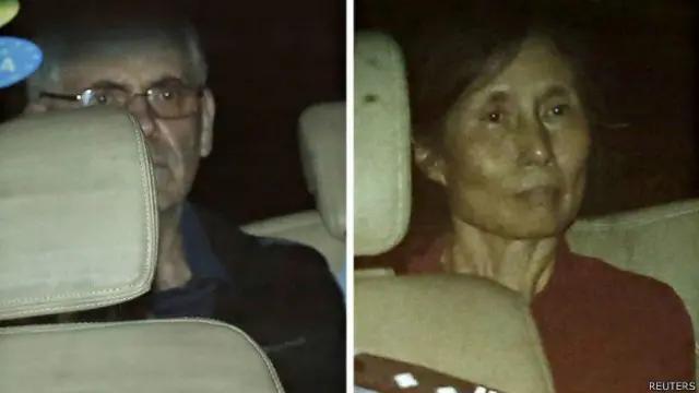 韩飞龙（左）与虞英曾（左）被带离上海市第一中级法院（8/82014）