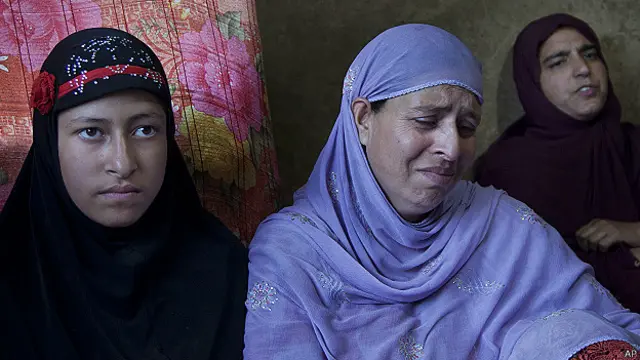 daughter Nisha Meraj, left and wife Zahida Meraj, family members of Mehrajuddin Dar