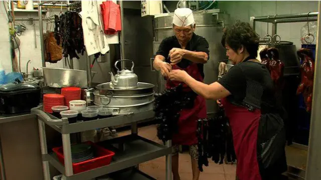 Pasangan Ha Wai Kay dan Betty Kong bisa menjalani masa pensiun setelah warung makanan mereka dibeli seorang konglomerat Singapura.