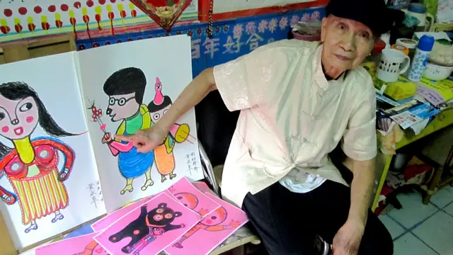 黄永阜与他的画作（BBC中文网图片）
