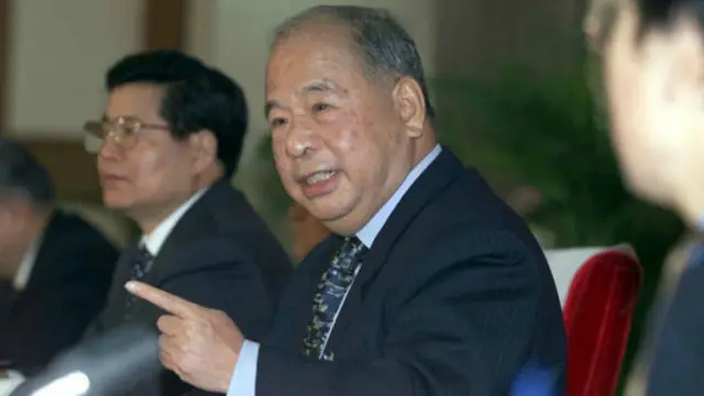 尉健行（新华社图片）