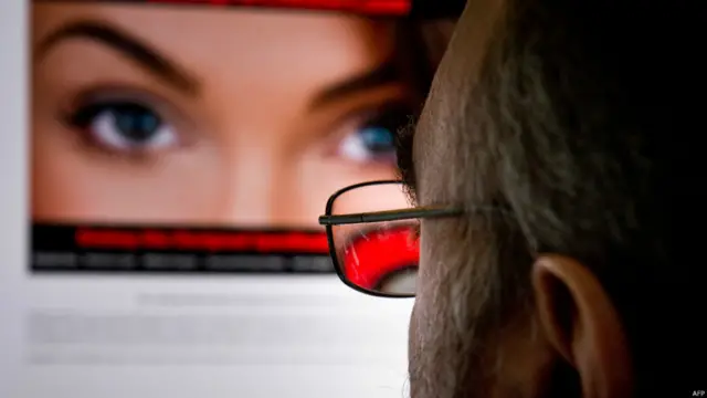 A man looks at Ashely Madison website