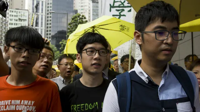 香港去年“雨伞运动”的学生领袖黄之锋、罗冠聪及周永康