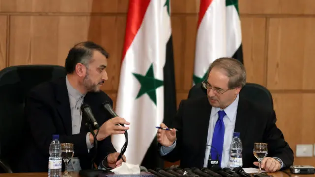 معاون نخست‌وزیر سوریه در کنار معاون وزیر خارجه ایران