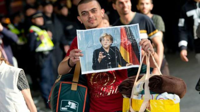 Беженец с портретом Меркель