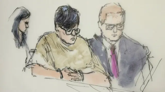 Enrique Marquez (tengah) dituduh membeli dua senapan secara ilegal yang digunakan oleh Farook dan istrinya, Tashfeen Malik dalam serangan di San Bernardino awal Desember lalu.