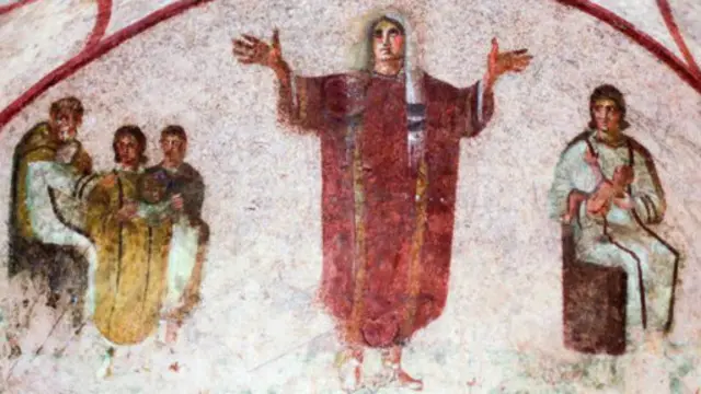 一幅壁畫描繪一名女性伸出雙手,有人以此作為女性在早期教會充當牧師的佐證。(Max Rossi/Reuters)