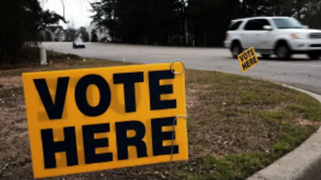 Cartel que llama a votar.