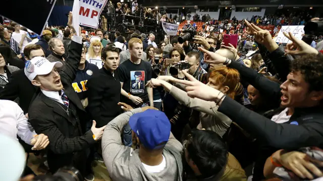 Pertikaian antara pendukung Trump dan penentangnya terus berlanjut meski acara pawai telah dibatalkan.