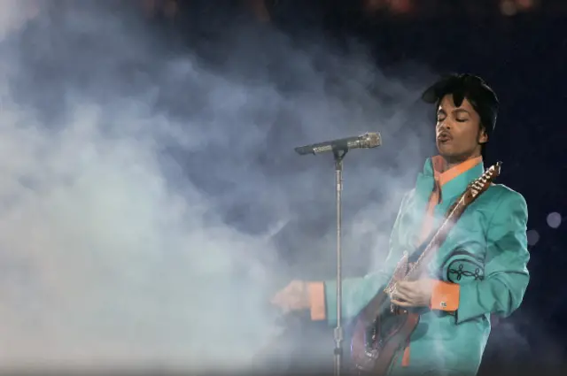 prince plaing guitar in smoke