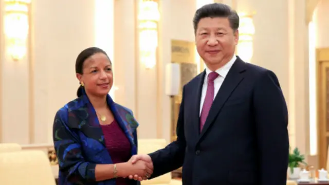 賴斯與習近平握手