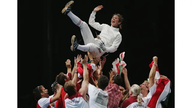 Timea Nagy of Hungary celebrates retaining the gold medal in the women's fencing individual epee gold medal match. Jamie Squire / Getty Images