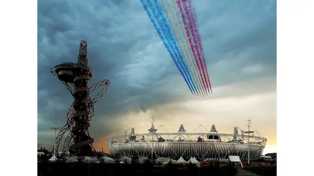 The Red Arrows fly over the Olympic Stadium in London during the opening ceremony for the 2012 Games. Elsa Garrison / Getty Images