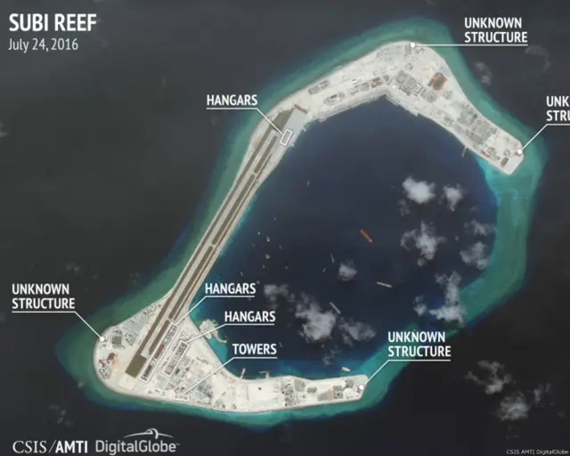 最新卫星照片说,中国可能已在南海争议岛礁上兴建强化飞机机库。