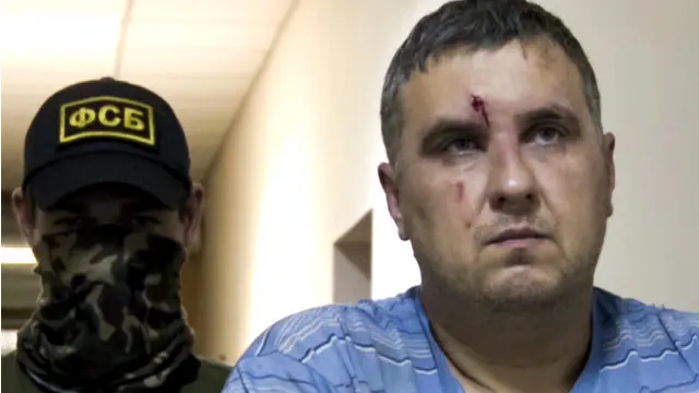 Євген Панов у супроводі бійця ФСБ