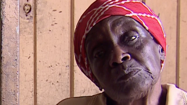 Vesta, 75, looks to the camera.