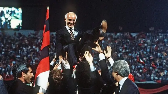 Arrigo Sacchi is hoisted aloft by celebrating Milan players