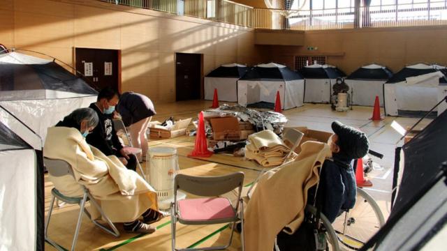 Residents shelter at an evacuation centre in Soma, Fukushima prefecture on March 17, 2022 after a 7.3-magnitude earthquake jolted east Japan the night before.